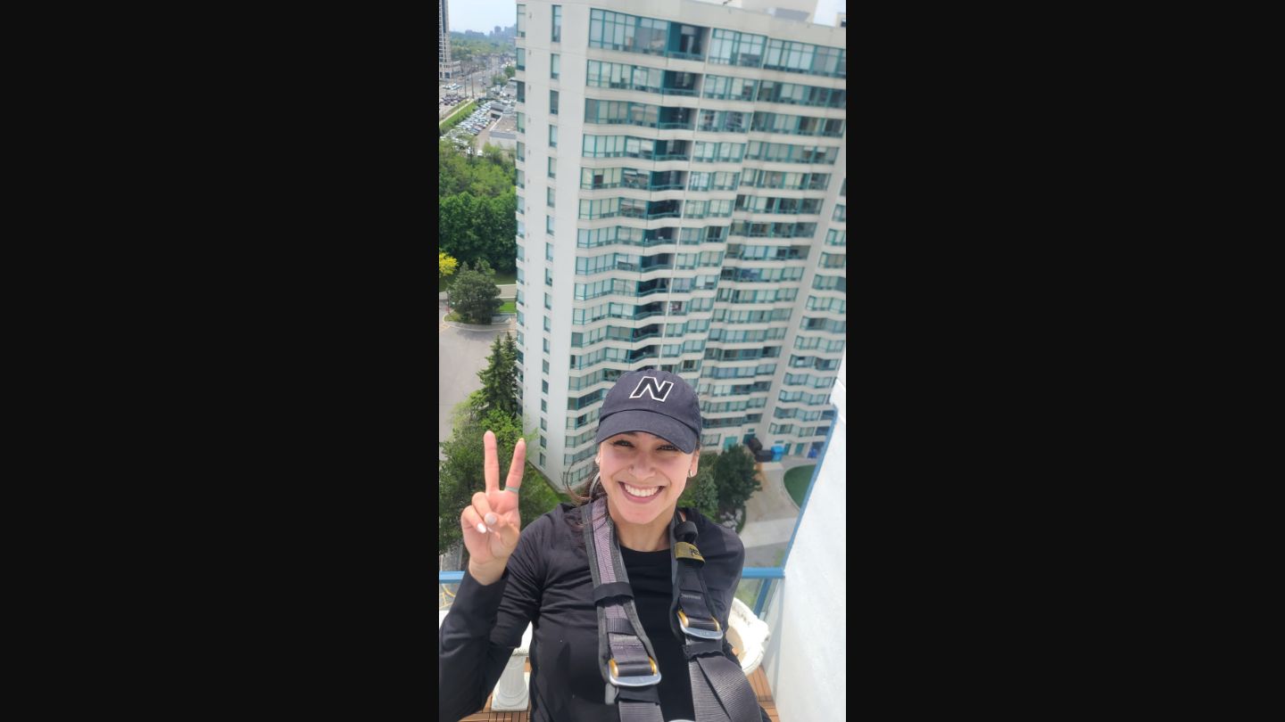 ClearGlass.ca team member on a high-rise building