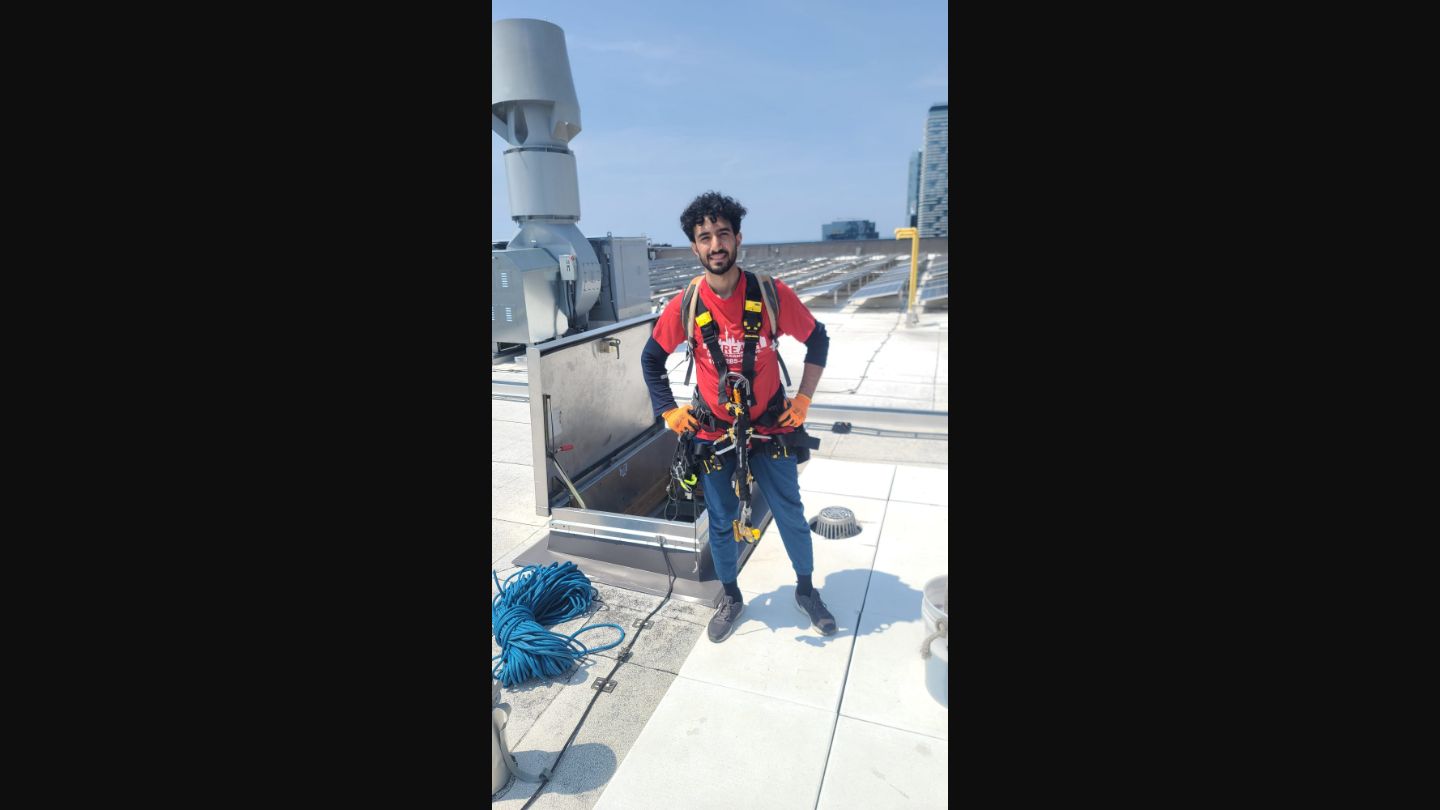 ClearGlass.ca technician with safety equipment on a rooftop